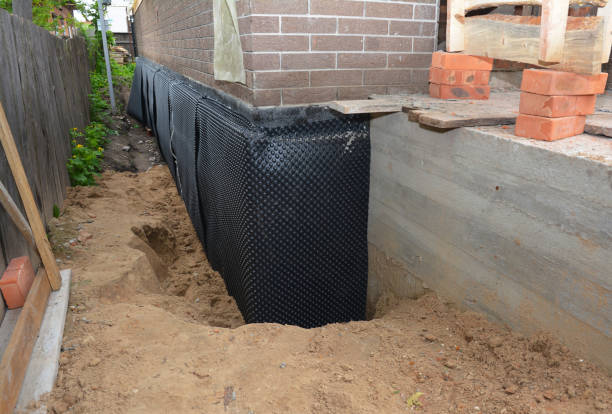 Happy homeowners after waterproofing job in Caldwell